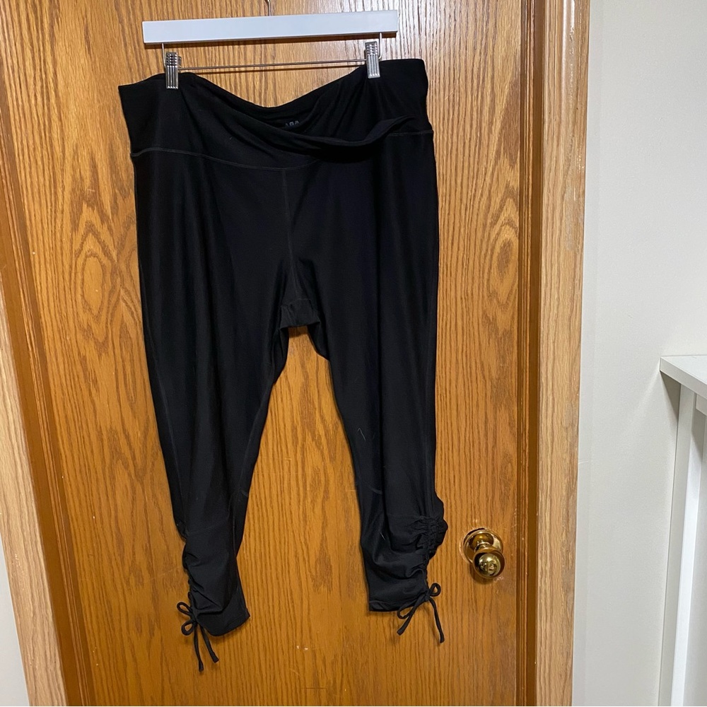 Workout pants with ruching and ties on the sides at the bottom Cris cross waist
